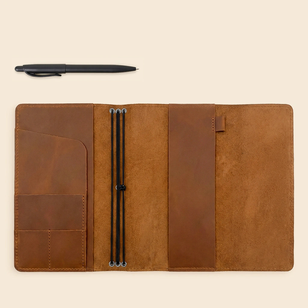 Elegant leather journal cover designed to keep notebooks and accessories neatly organized.