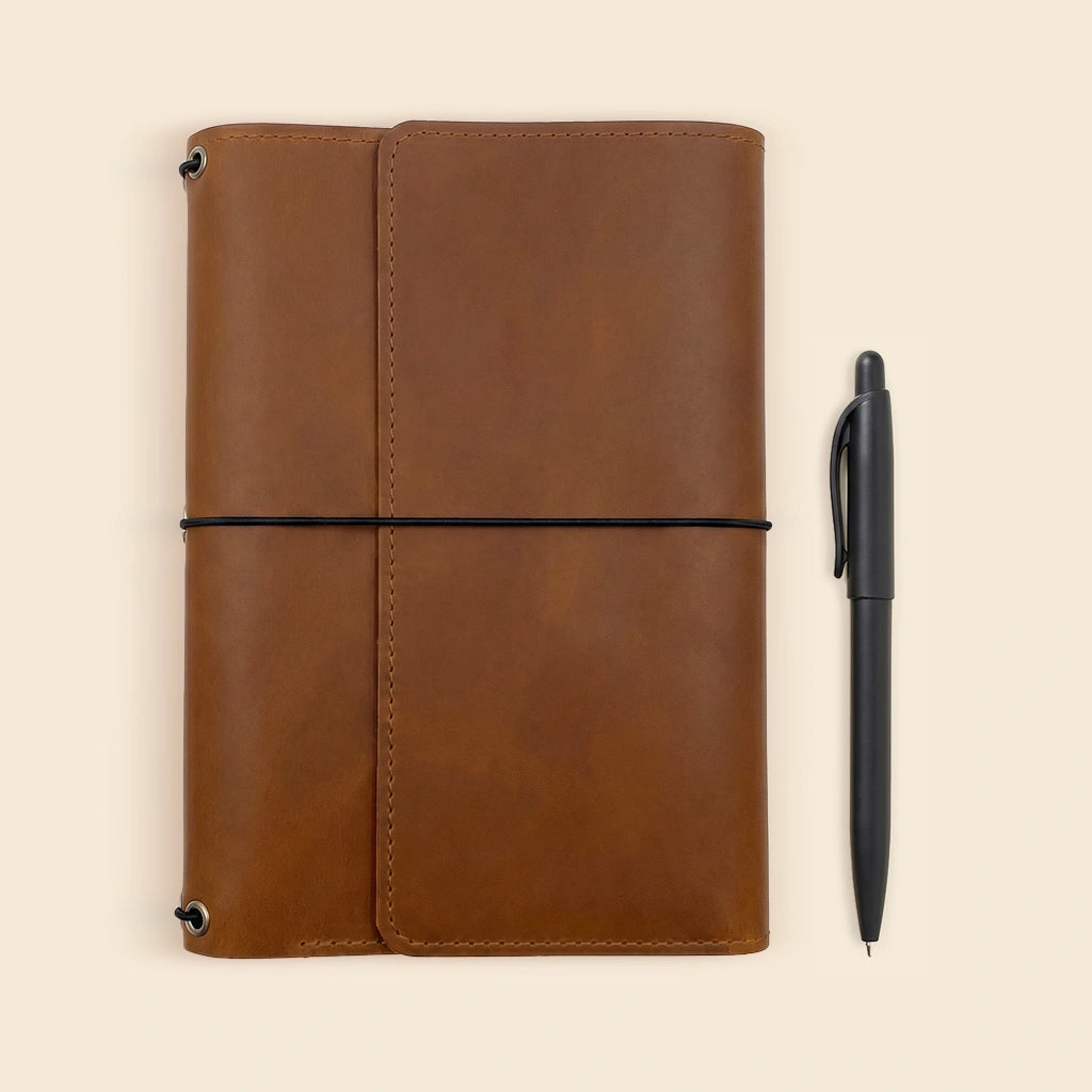 Handmade leather notebook portfolio designed for planners, journals, and writing notebooks.