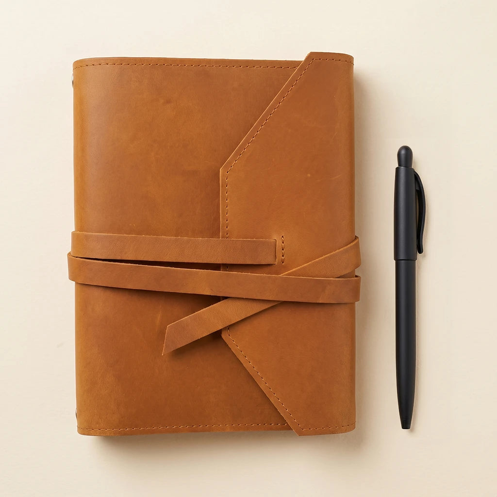 Crafted leather journal holder designed for notebooks, pens, and daily notes.