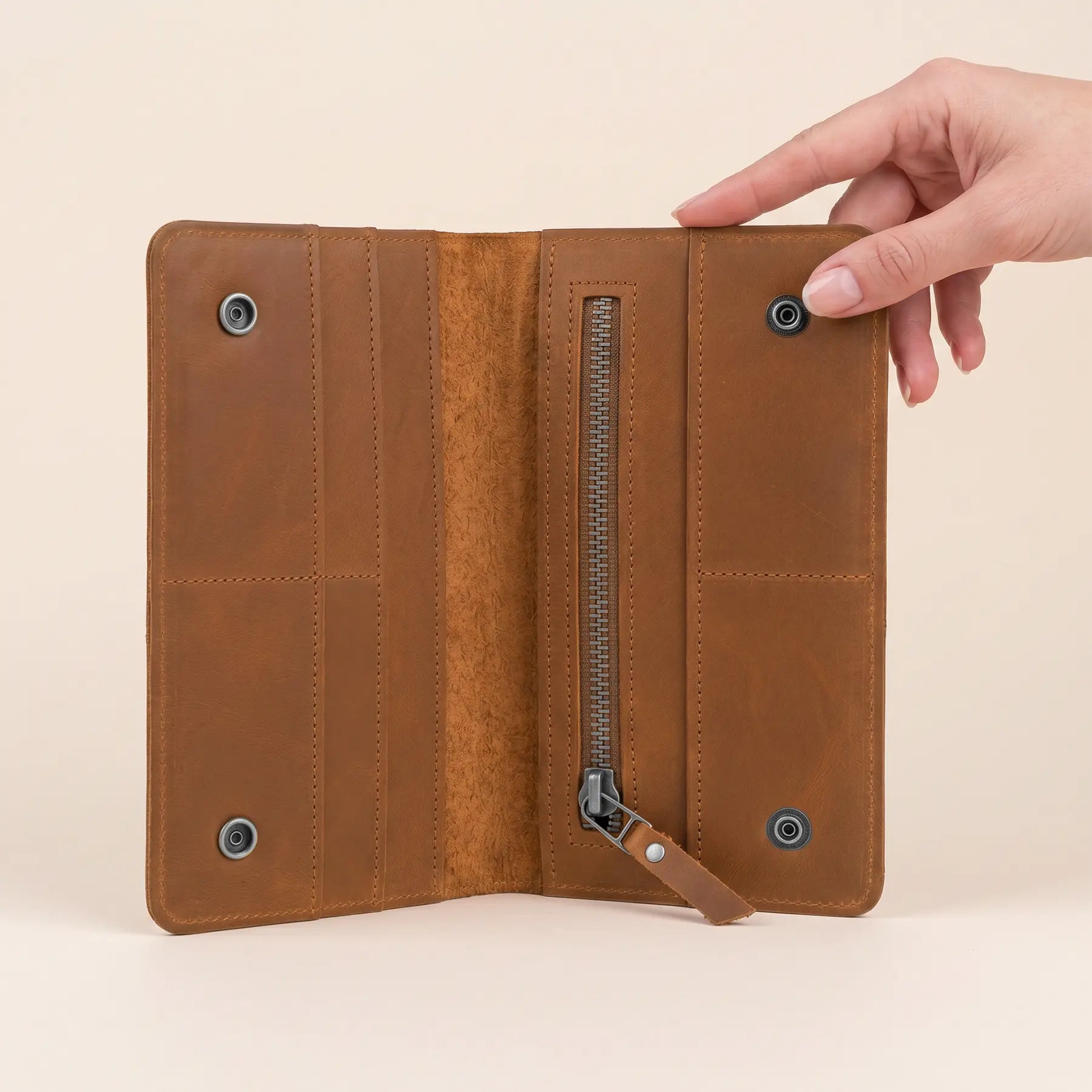 Genuine leather wallet with multiple card slots, spacious bill compartments, and secure snap closure.