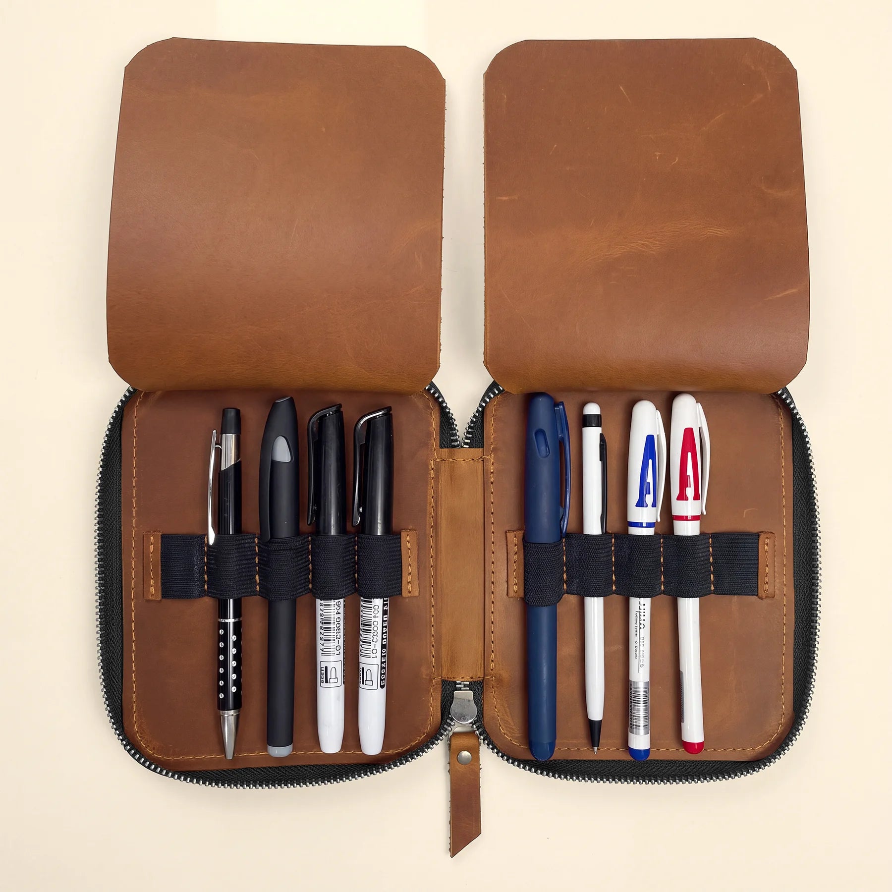 Premium leather writing accessory case with zipper for pens and small essentials.