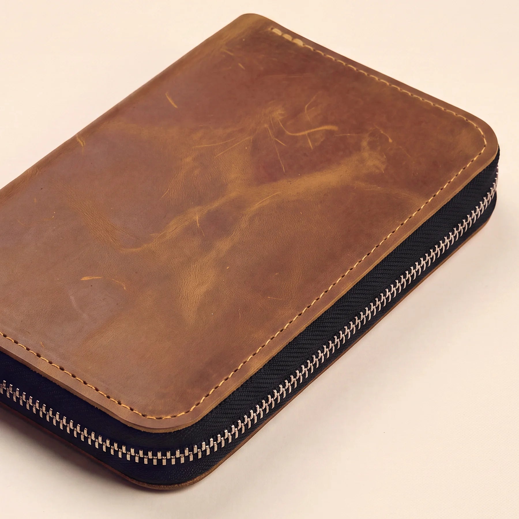 Genuine leather zippered pencil case with handcrafted quality and elegant minimalist style.