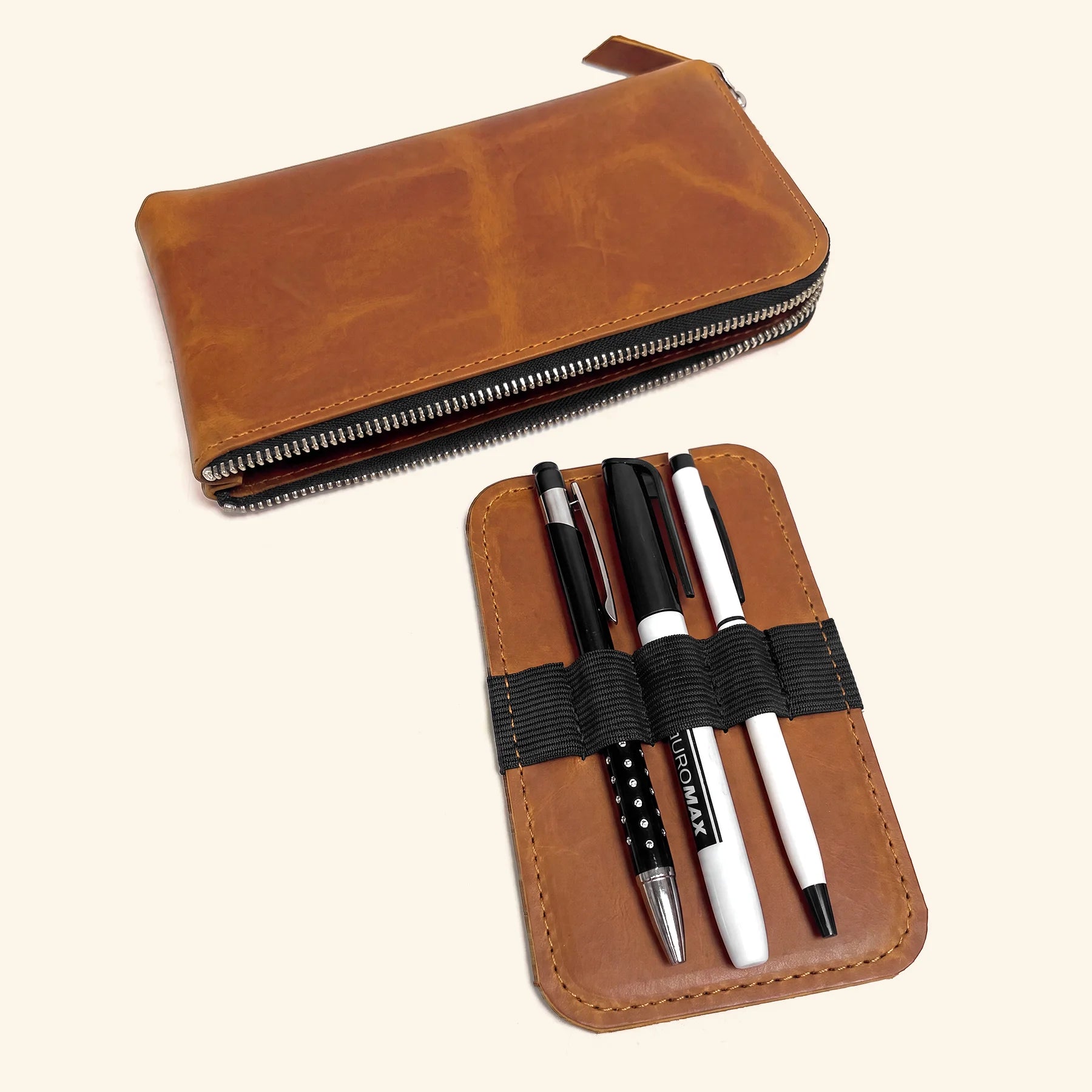 Genuine leather writing instrument case with smooth zipper and artisan craftsmanship.