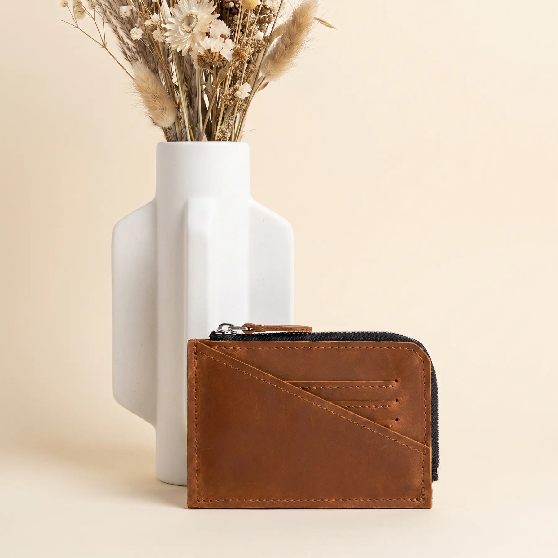 Small genuine leather zip wallet featuring secure zipper closure and durable handcrafted construction.