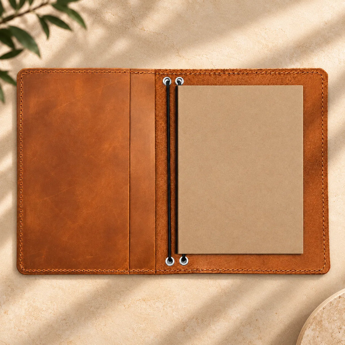 Genuine leather notebook cover with two elastic bands and carefully designed inner pockets.