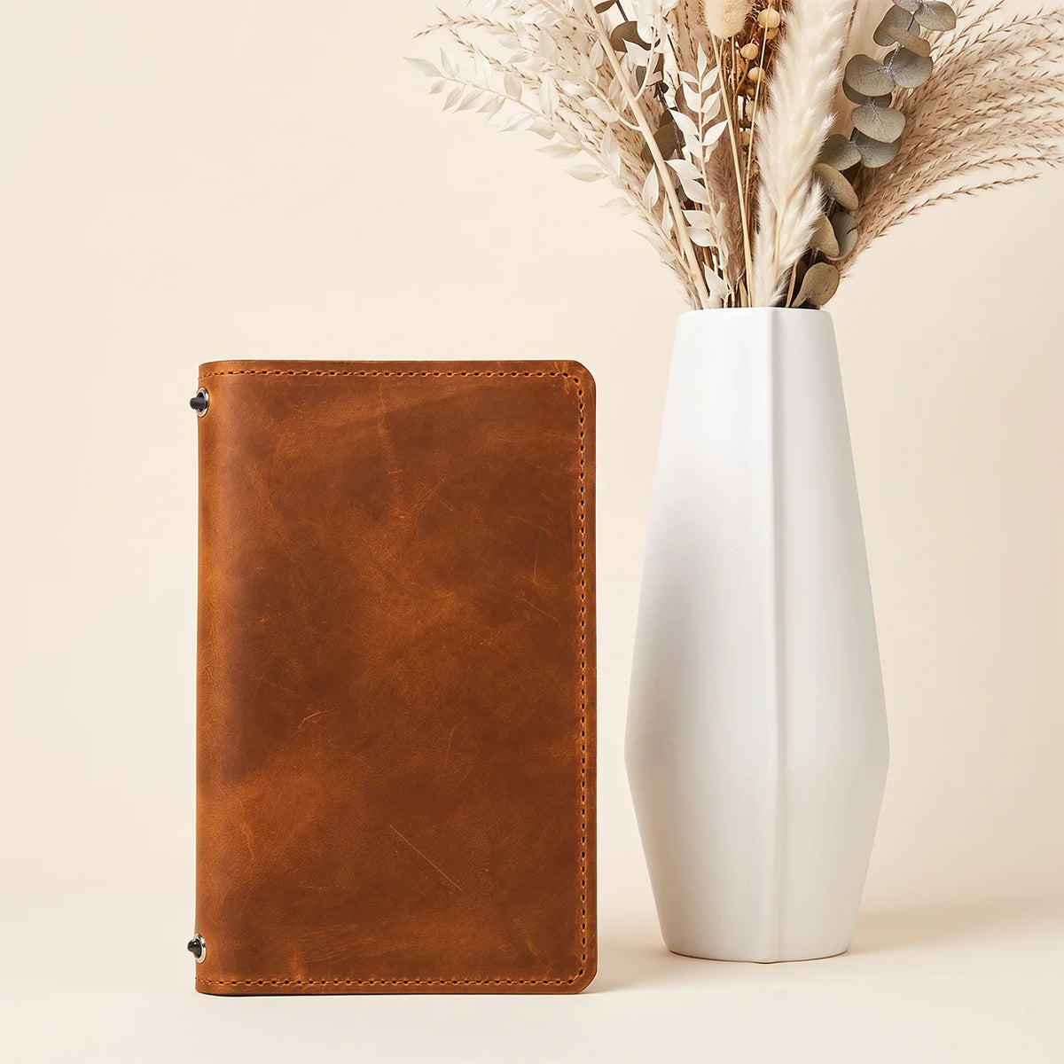 Handmade Crazy Horse leather planner cover with secure bands and built-in storage compartments