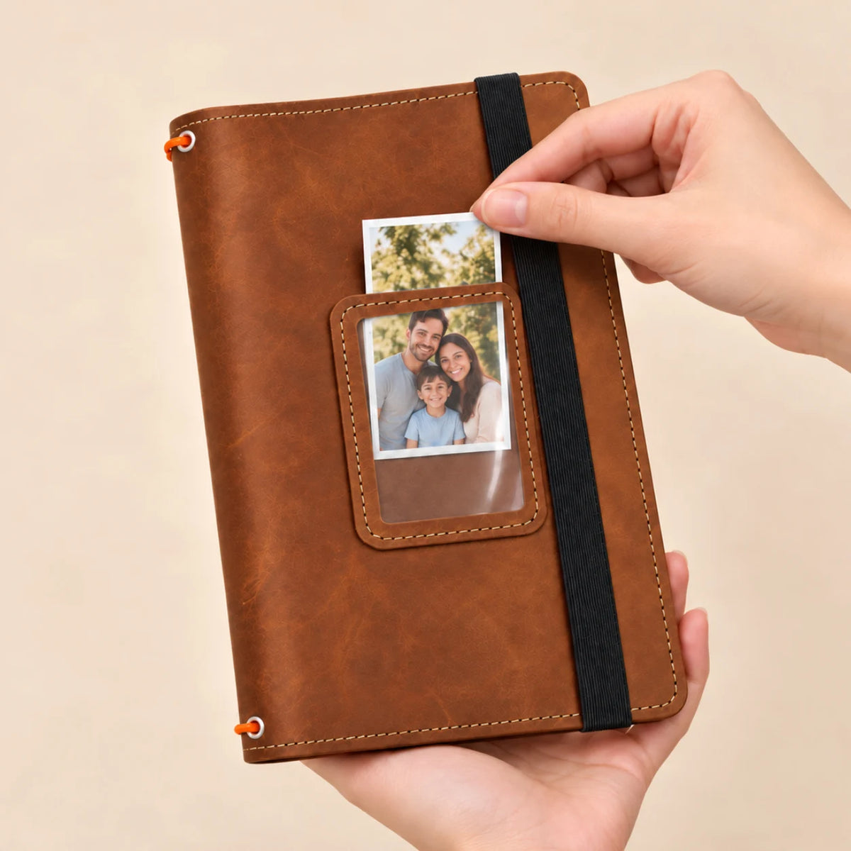 Genuine leather journal cover with three elastic retainers, practical storage spaces, and transparent image window.