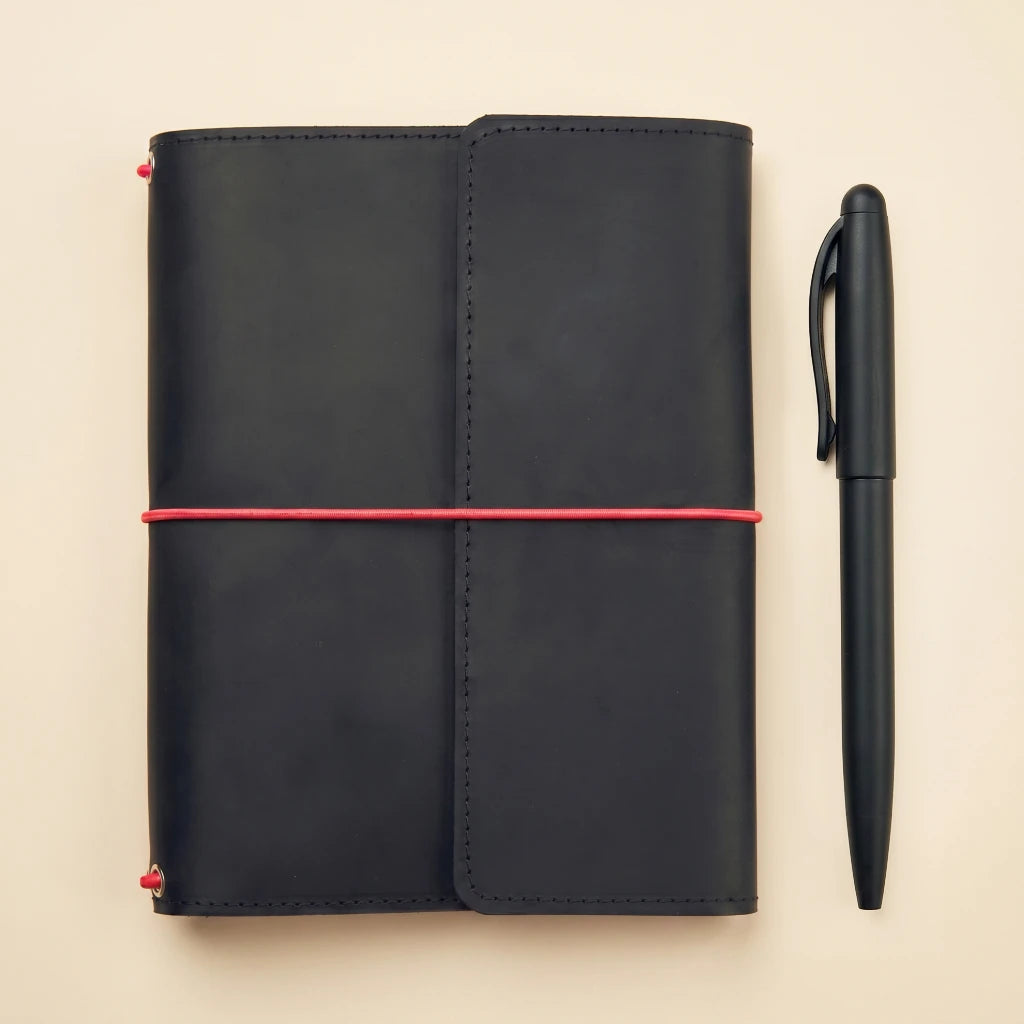 Leather diary cover with elastic straps, organizer pockets, and built-in pen loop