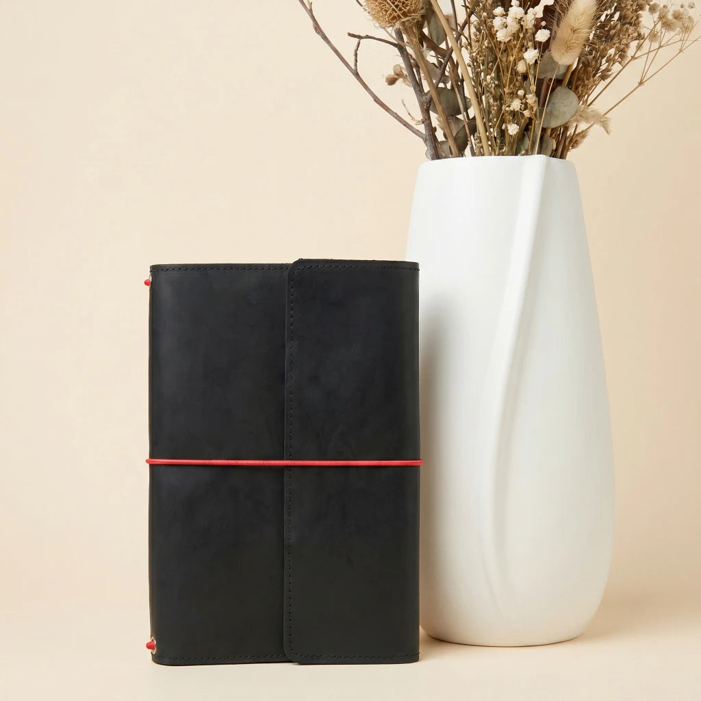 Vintage style leather notebook cover with elastic closure and practical pen loop