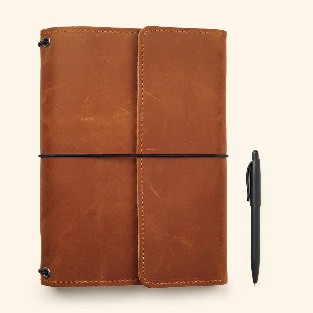 Handmade leather writing cover featuring interior organization and secure notebook elastic loops.