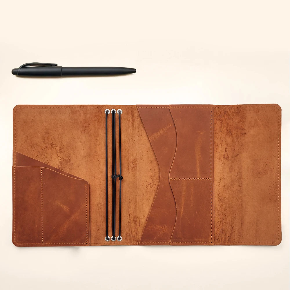 Leather planner cover crafted for refillable notebooks with practical pockets and elastic loops.