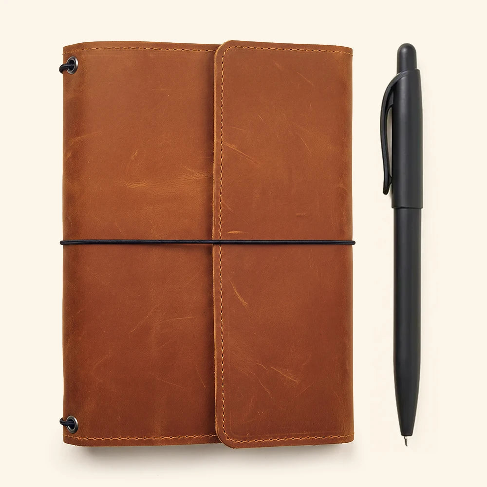 Genuine leather notebook case with three elastic holders and functional interior organization pockets.