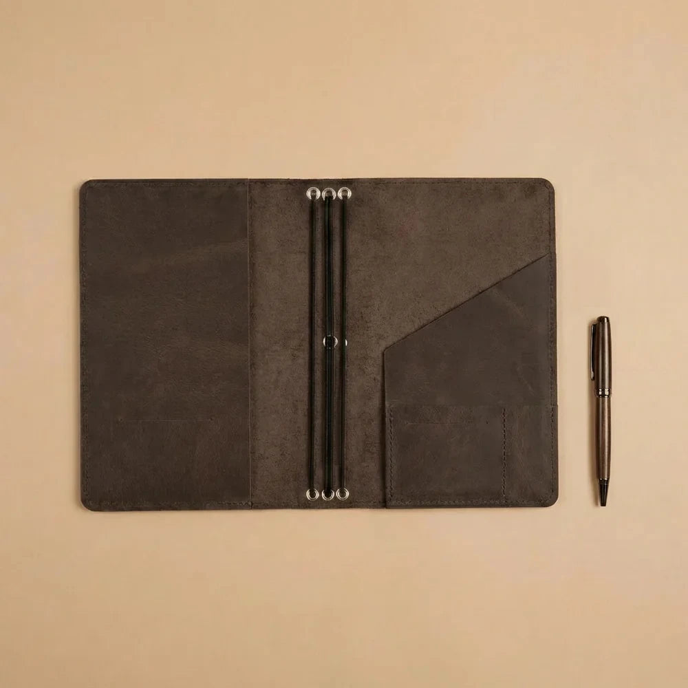 Full grain leather journal cover with refillable notebook system and interior utility pockets.