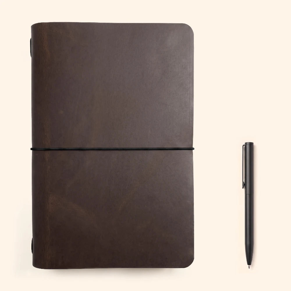 Leather notebook cover with artisan craftsmanship and a clean, practical interior design.