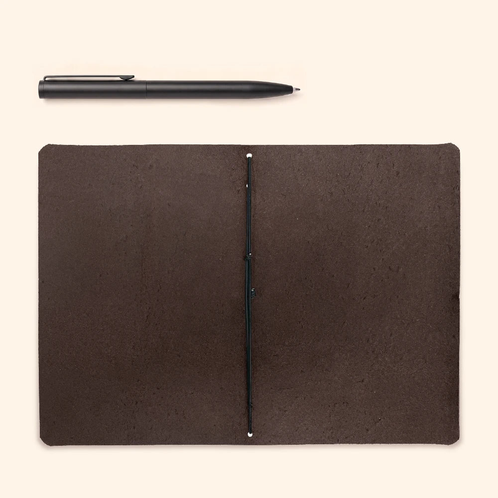 Classic writing journal cover made from natural leather with understated functional details.
