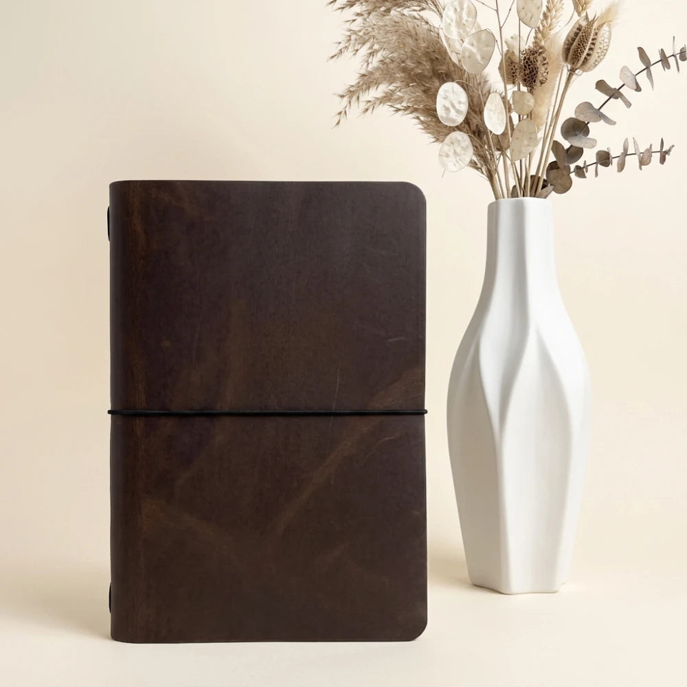 Natural leather notebook cover with clean minimalist style and simple refillable notebook.