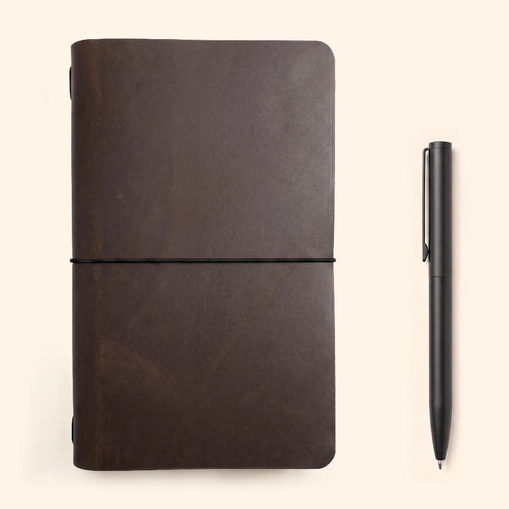 Natural leather notebook wrap with a flexible loop for holding the journal securely.