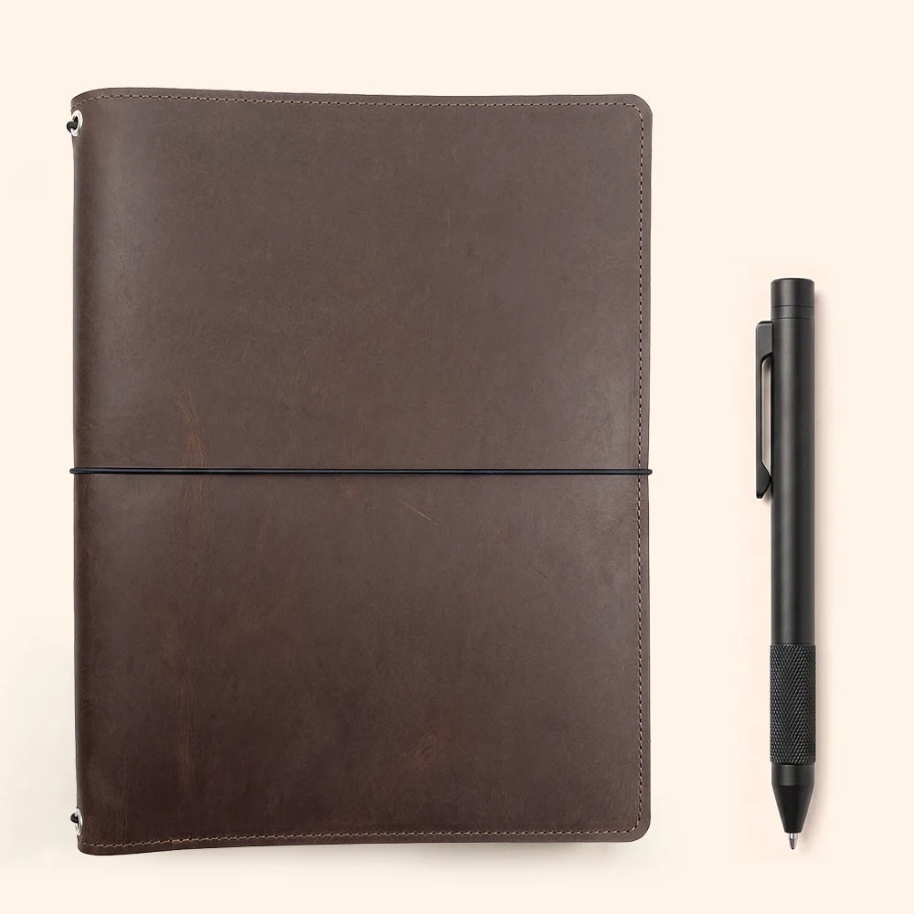 Natural leather refillable cover providing convenient storage for journals and everyday papers.