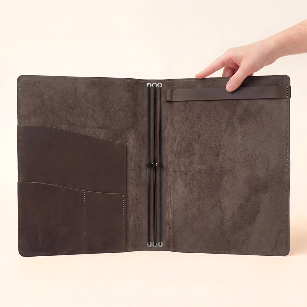 Natural leather notebook case featuring a streamlined interior for organized daily journaling.