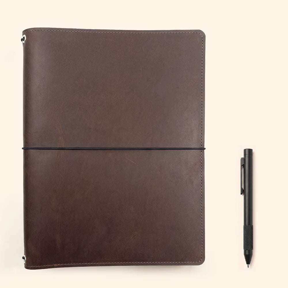 Handcrafted leather cover with flexible bands to secure different notebook refills inside.