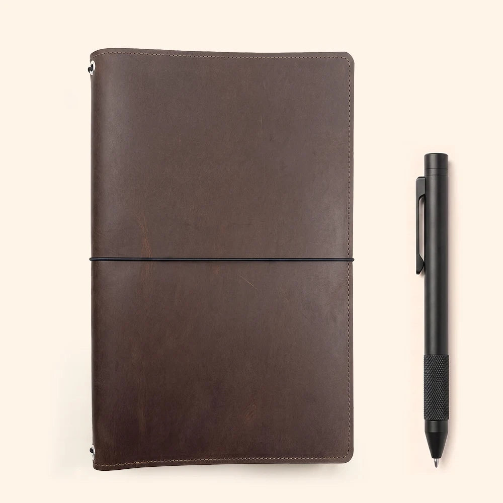 Open leather cover displaying a practical layout for journaling, drawing, and daily planning.
