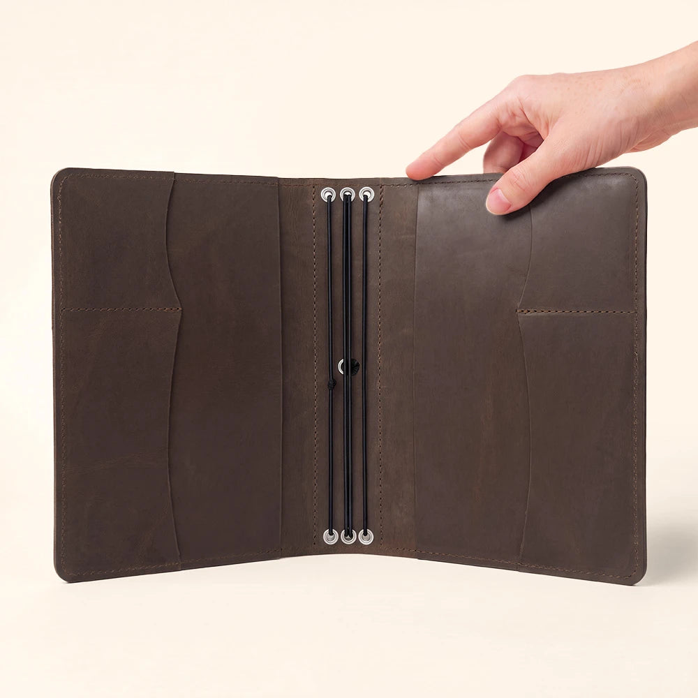 Handmade journal cover featuring genuine leather, interior organization, and stitched pen holder.
