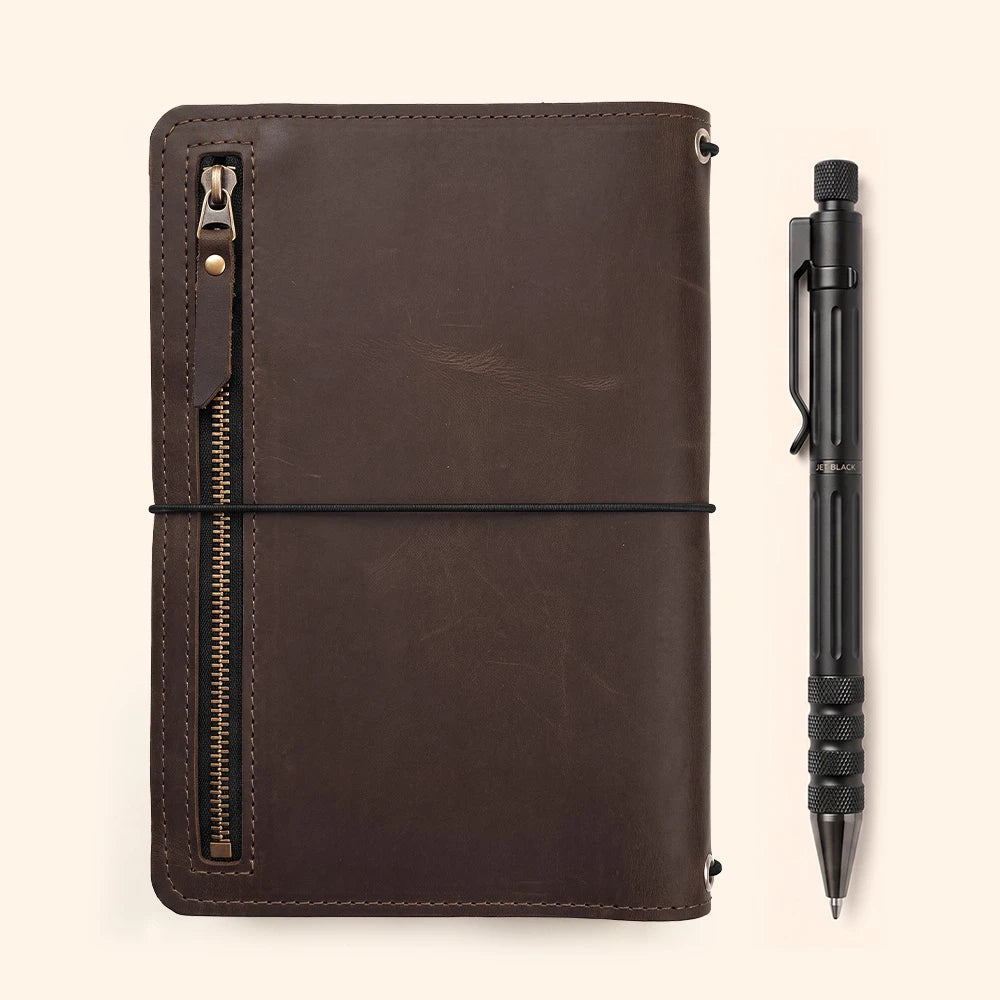 Leather writing notebook cover with built-in card pockets and matching pen holder loop.