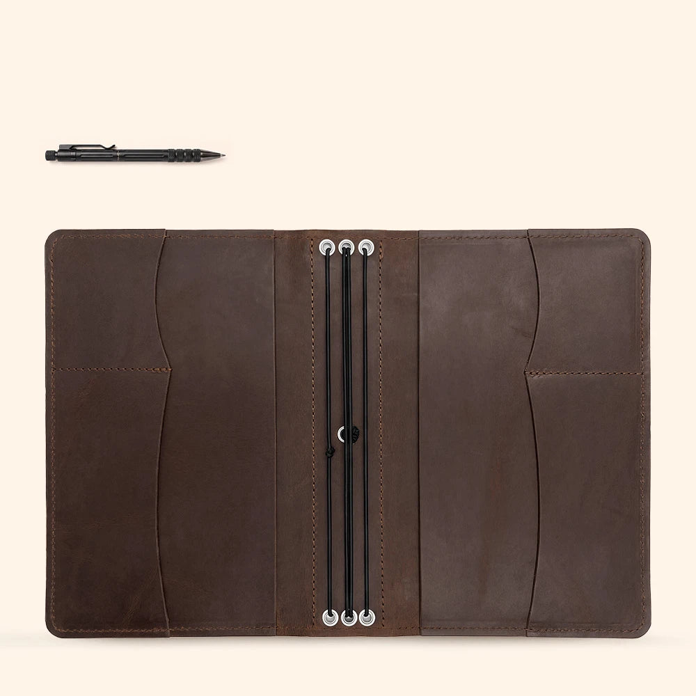 Refillable leather journal cover offering organized interior space for notes and writing tools.