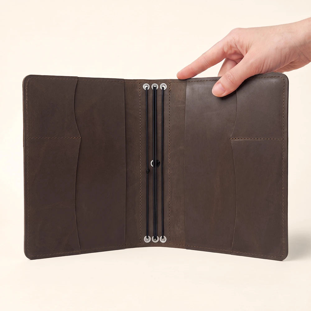 Durable leather journal cover featuring spacious interior pockets and handy pen holder.