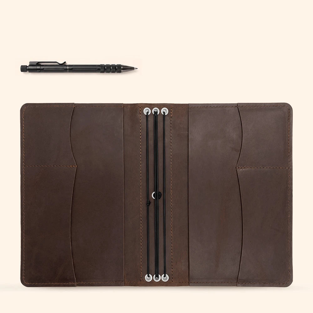 Leather planner organizer with handcrafted pockets and secure pen carrying solution.