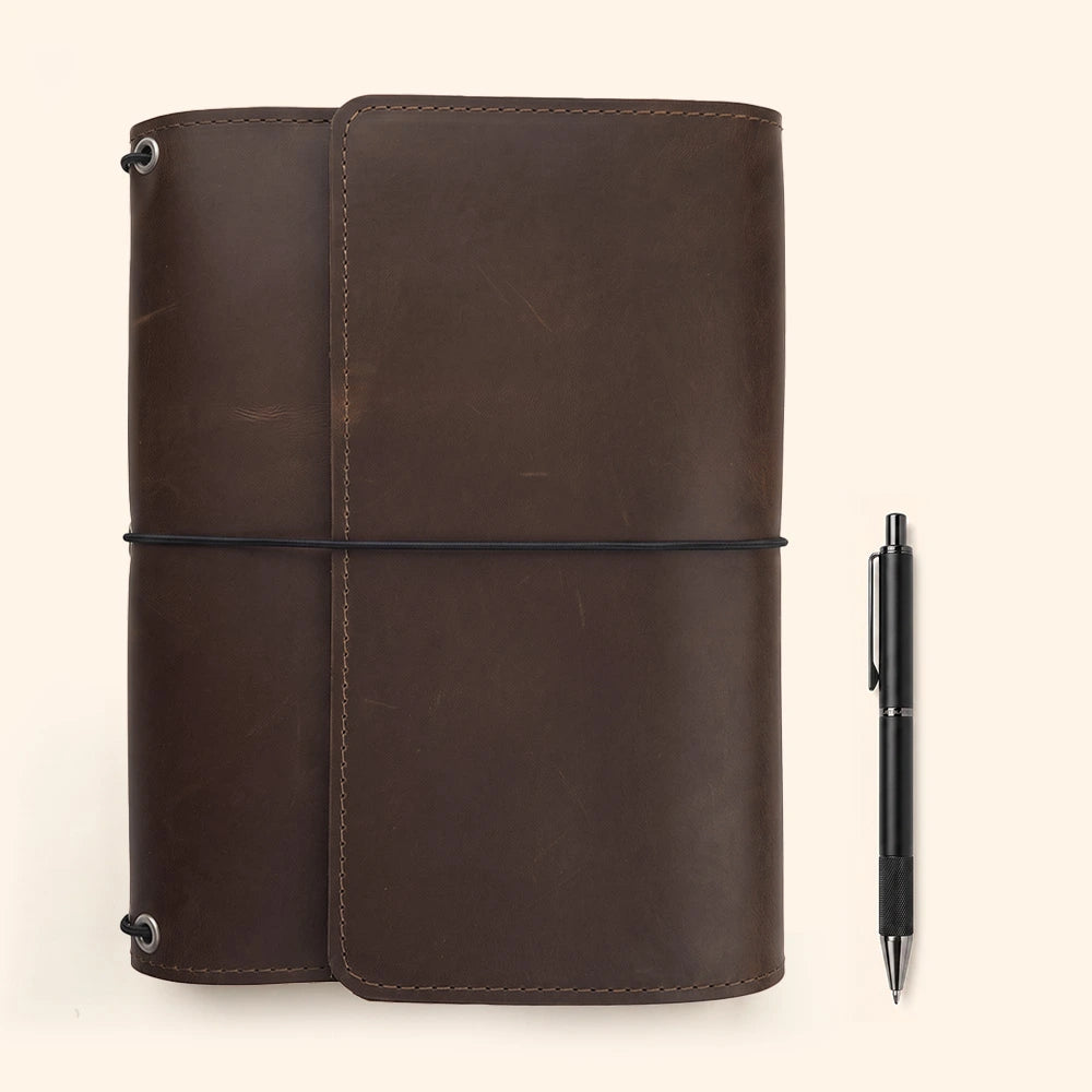 Genuine leather planner jacket with hidden storage compartments and integrated pen carrying loop.