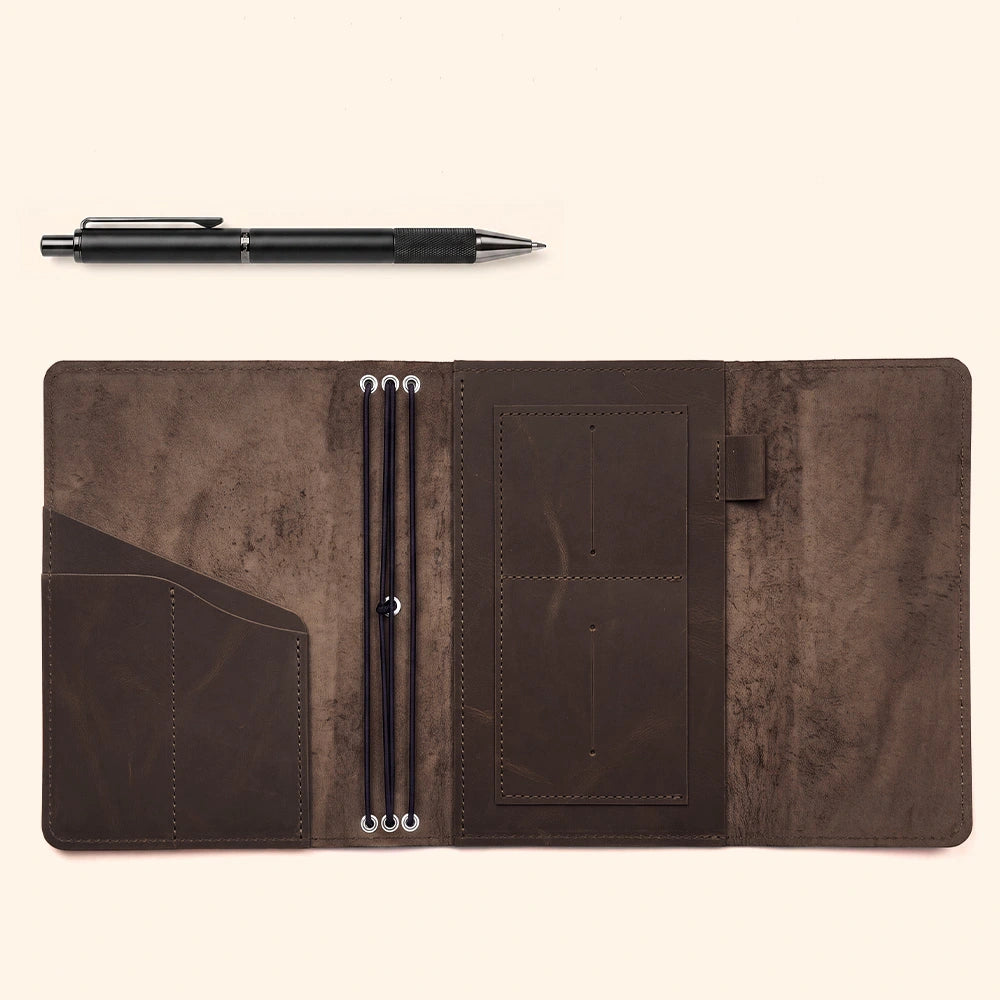 Genuine leather notebook cover designed with organizer pockets and convenient leather pen holder.