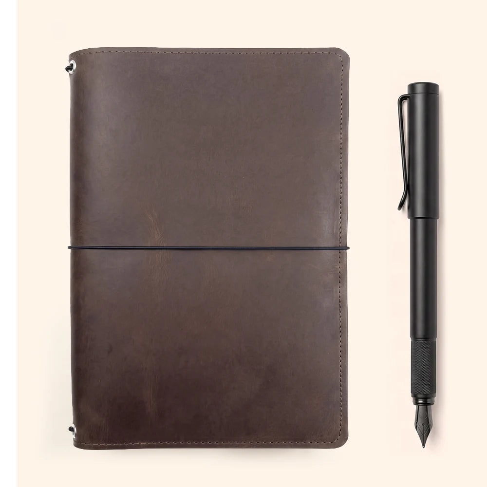 Minimalist natural leather notebook holder featuring three flexible elastic bands.