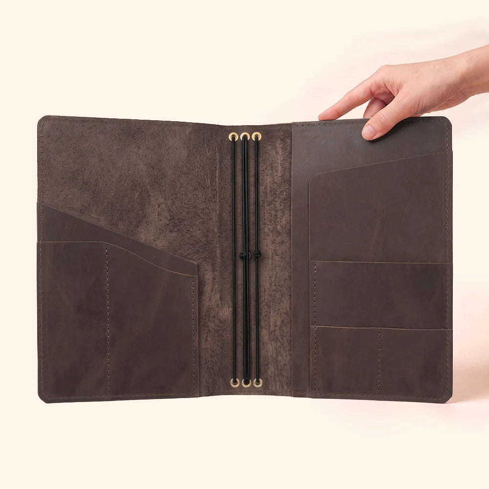 Compact leather cover organizing three independent journal inserts in one place.