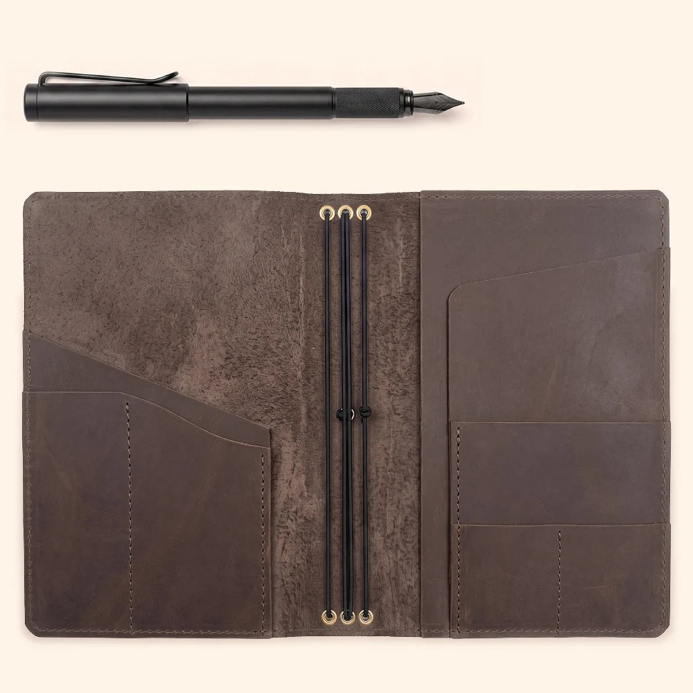 Handmade leather notebook holder featuring three elastic loops for refillable journal inserts.
