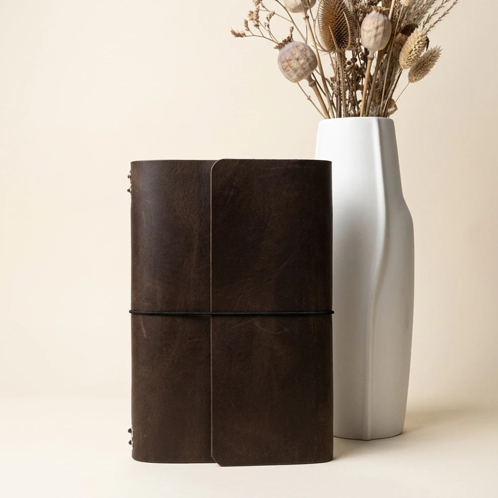 Natural leather notebook case built for six replaceable inserts and daily note-taking.