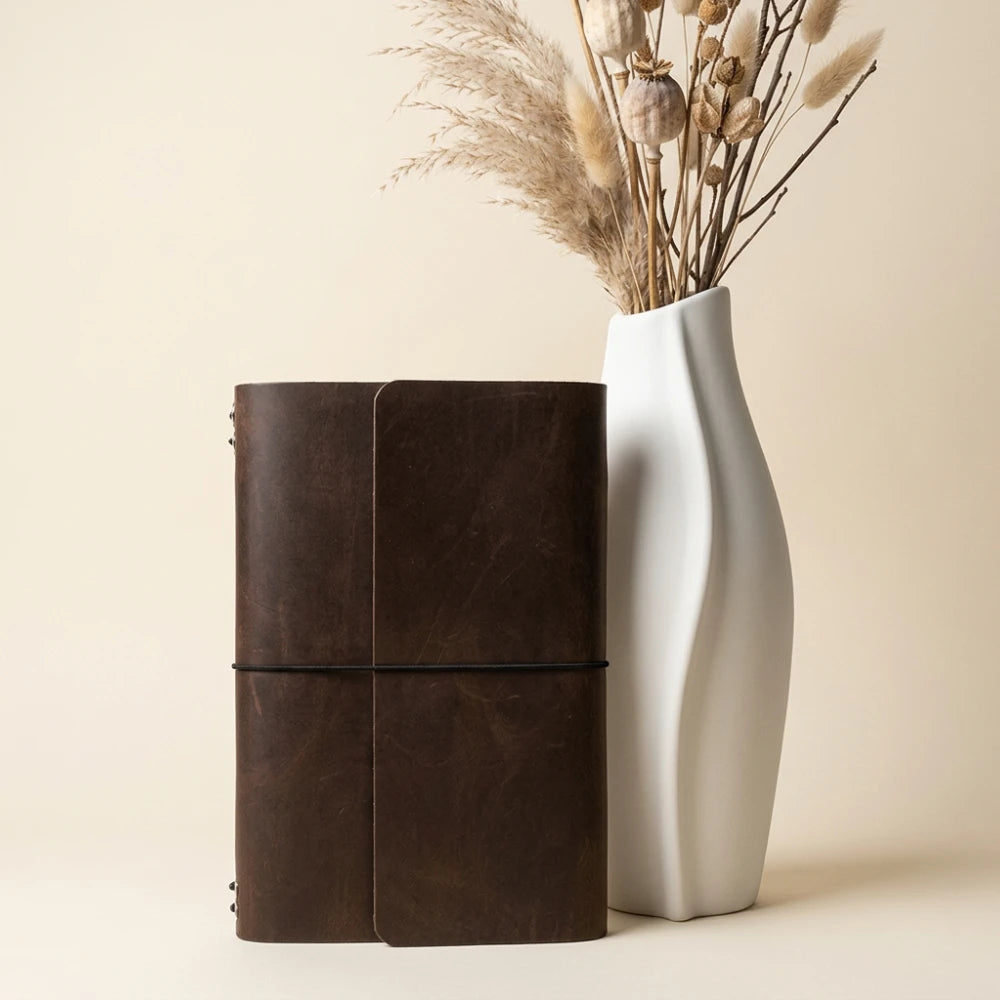 Full grain leather journal shell featuring six flexible cords for personalized notebook layouts.