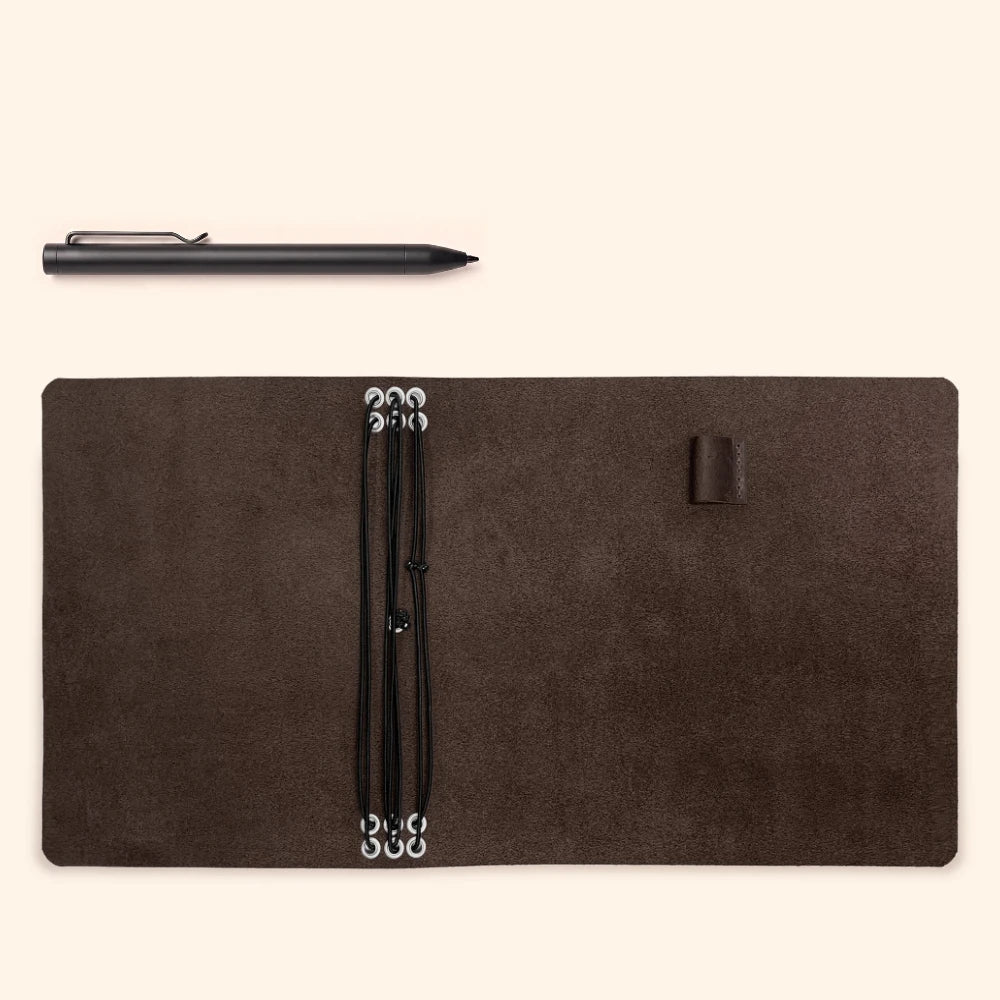 Minimalist natural leather notebook holder with six elastic straps and pen storage.