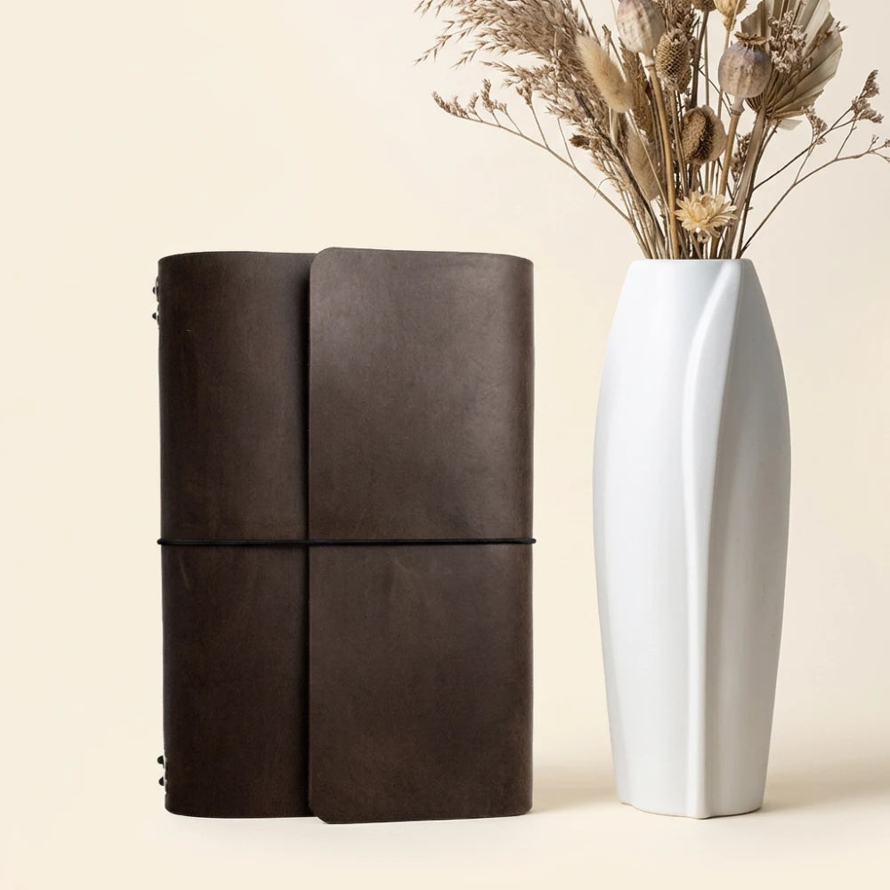 Handmade refillable cover crafted from genuine leather with six insert bands inside.