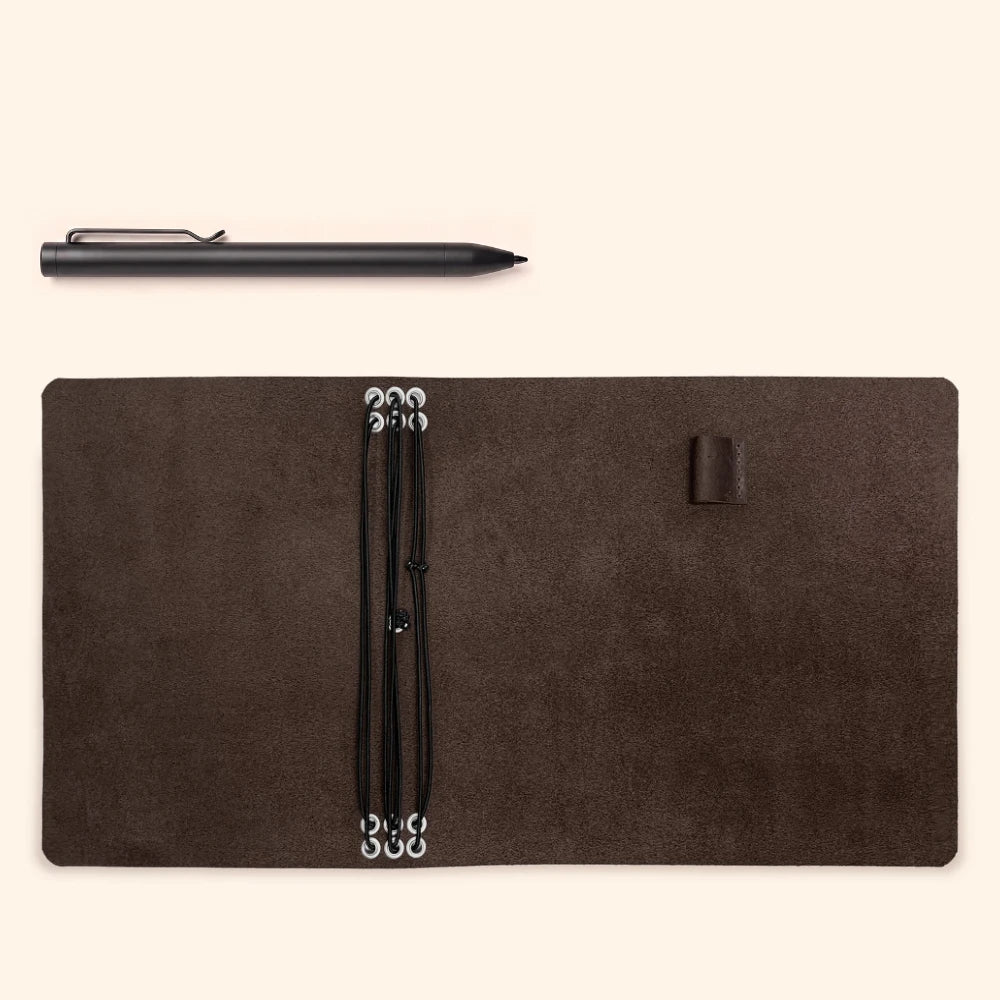 Premium leather notebook cover with six elastic inserts and an attached pen loop.