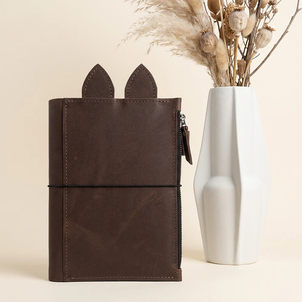 Genuine leather planner cover featuring three insert bands and a smooth interior finish.
