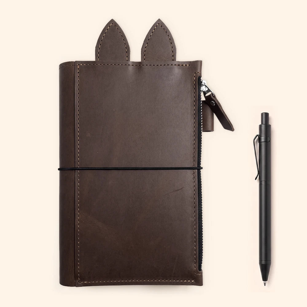 Genuine leather notebook cover designed with three elastic cords for multiple inserts.