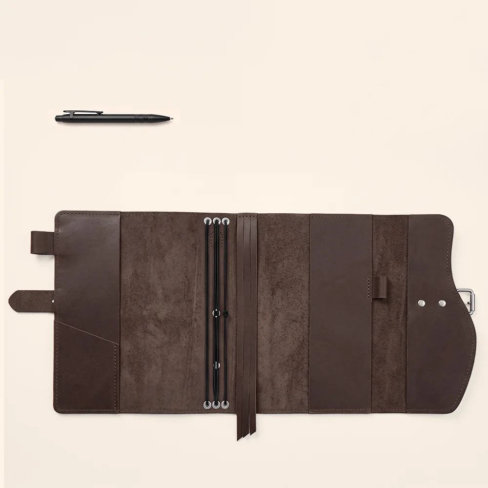 Leather writing case featuring interior pockets, elastic pen loop, page marker, and sturdy outside handle.