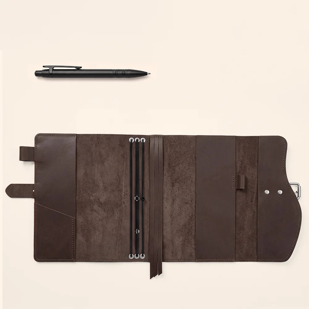 Leather writing organizer with multiple storage pockets, dedicated pen keeper, sewn bookmark, and comfortable carry grip.