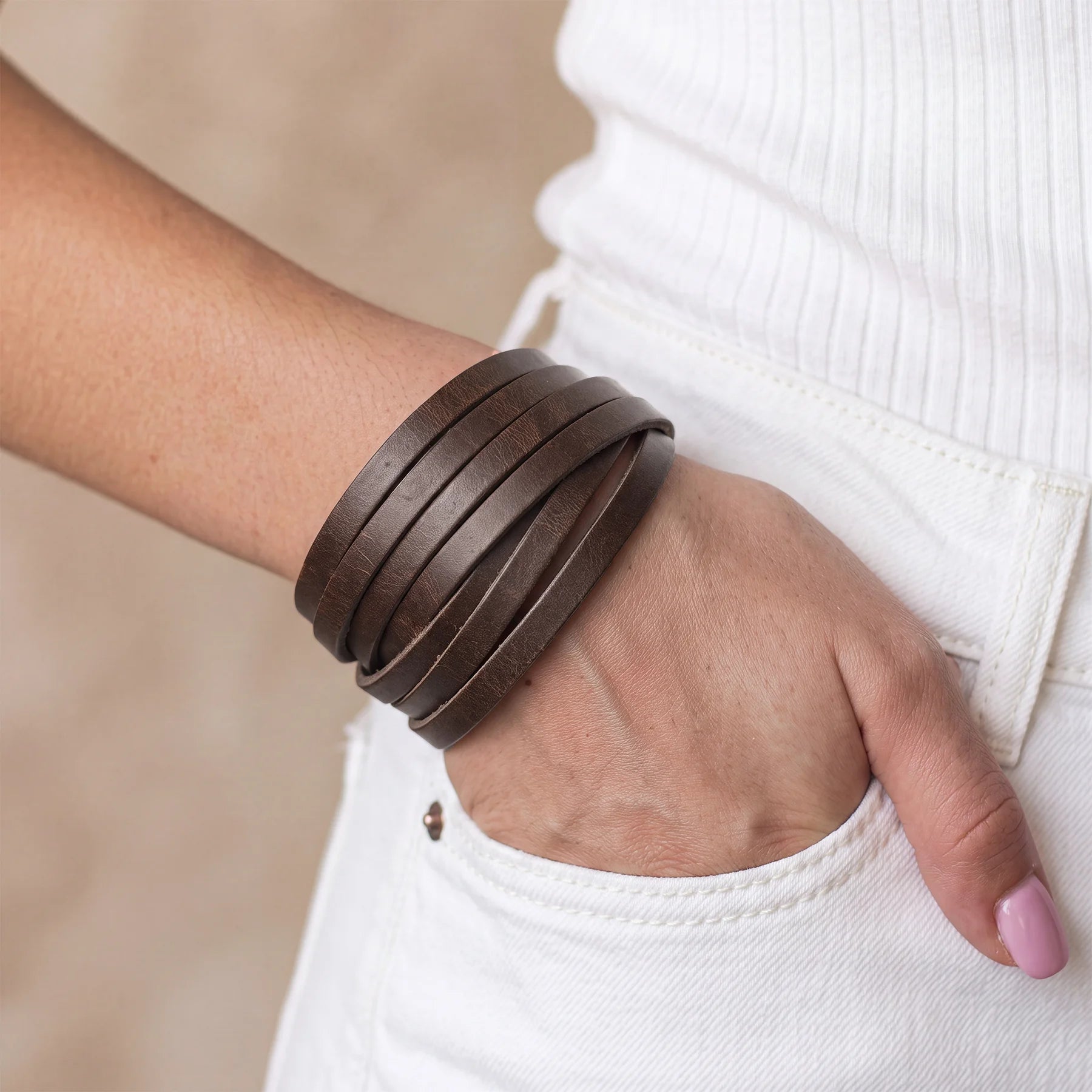 Genuine leather bracelet with elegant design, secure snap button, and comfortable everyday fit.