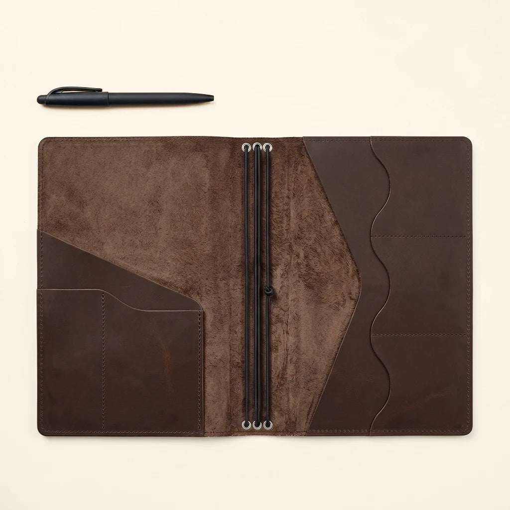 Refillable leather organizer designed for planners, notebooks, and travel records.