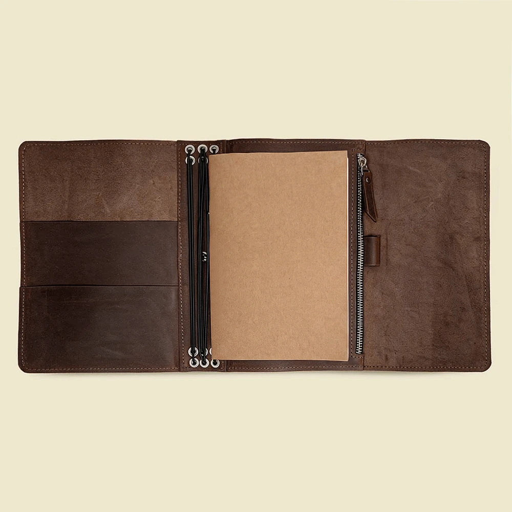 Natural leather journal cover featuring multiple pockets and six secure elastic notebook bands.