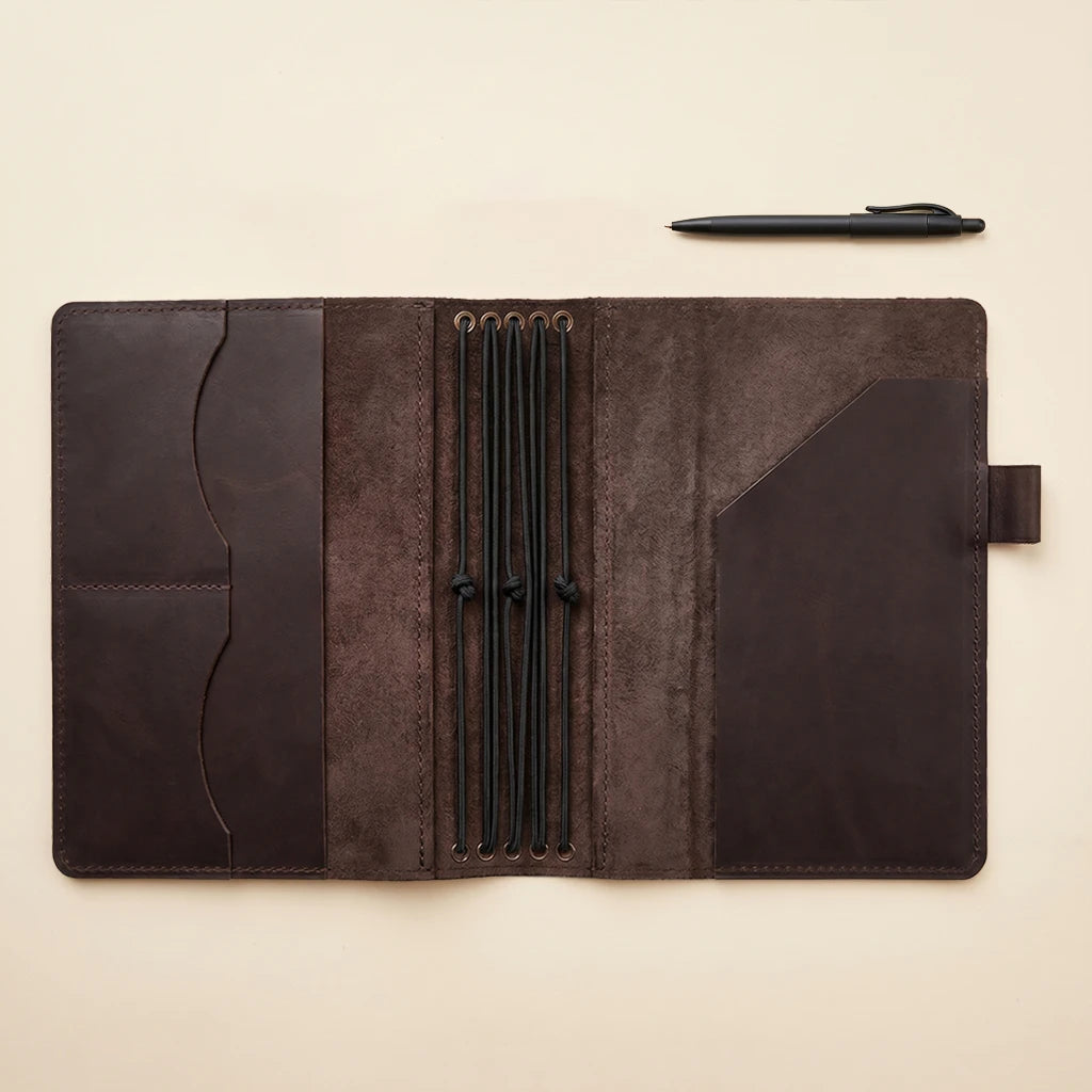 Premium leather journal holder with interior pockets and refillable notebook design