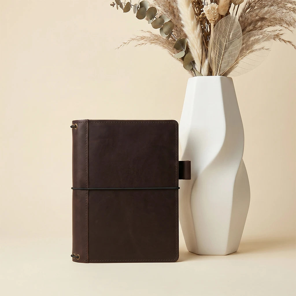 Handmade leather writing organizer with elastic notebook bands and pen loop