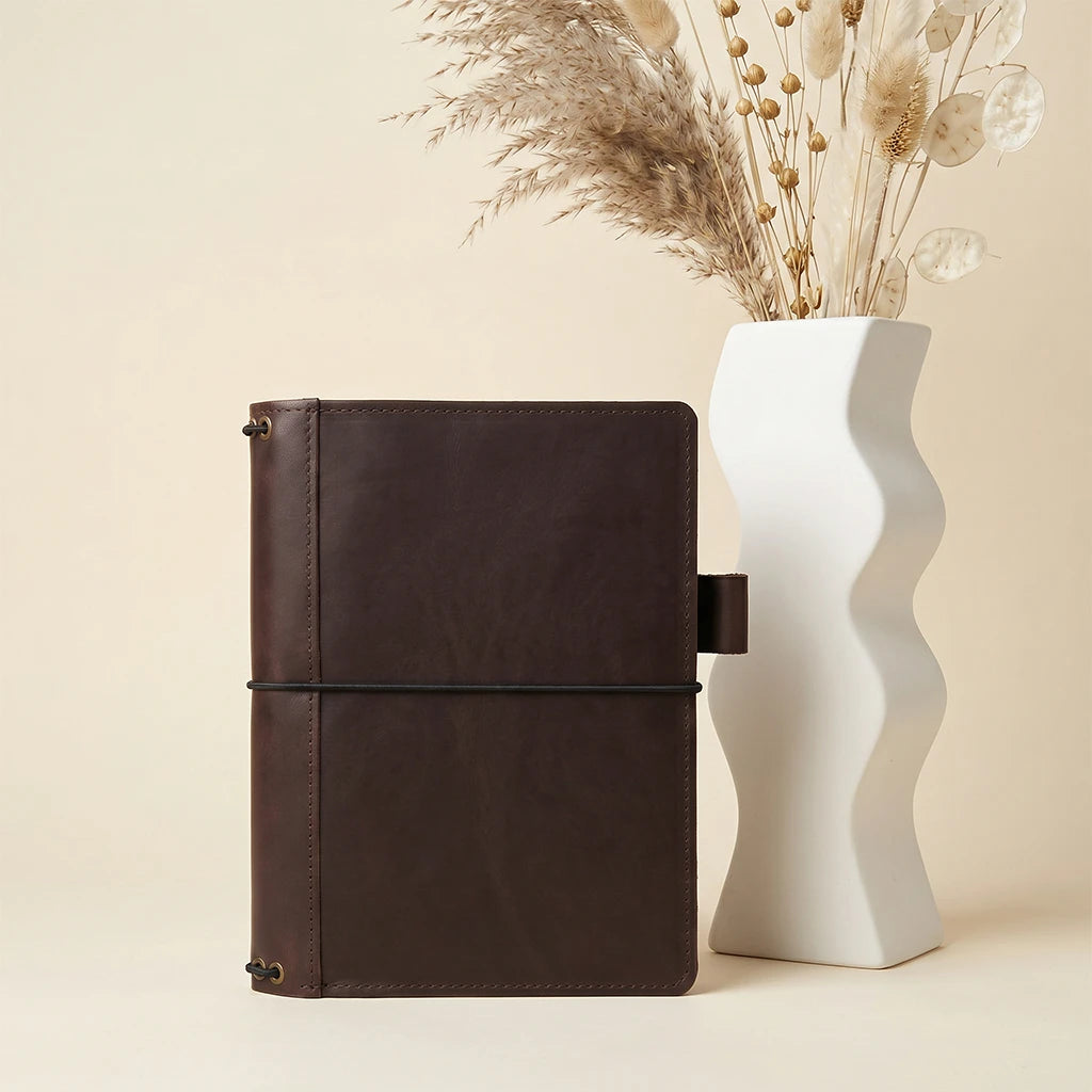 Refillable leather journal case with organized interior and elastic notebook bands